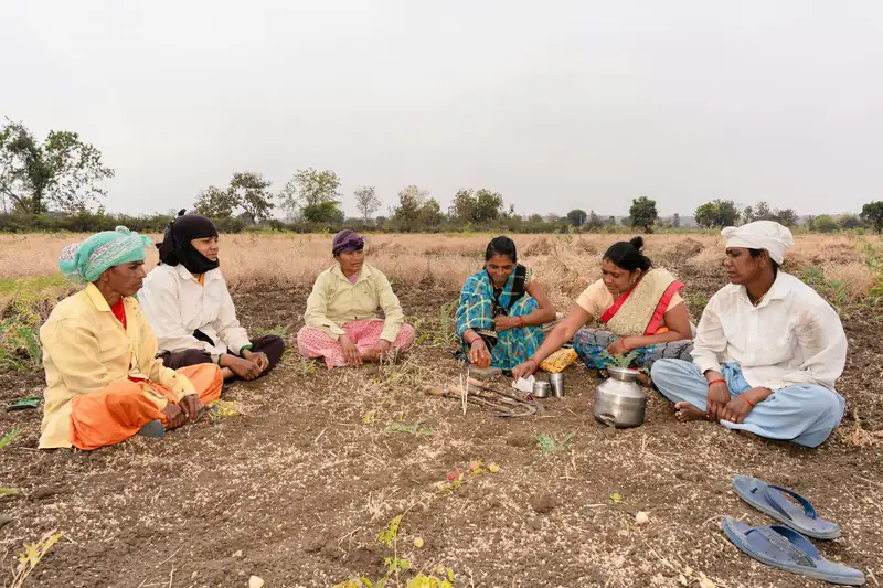 Farmers meeting in a field
