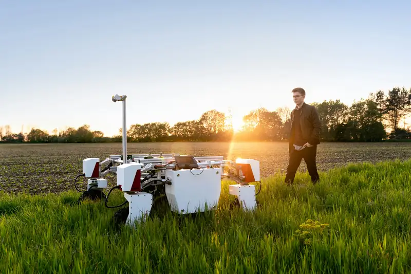 Autonomous field robot at sunset